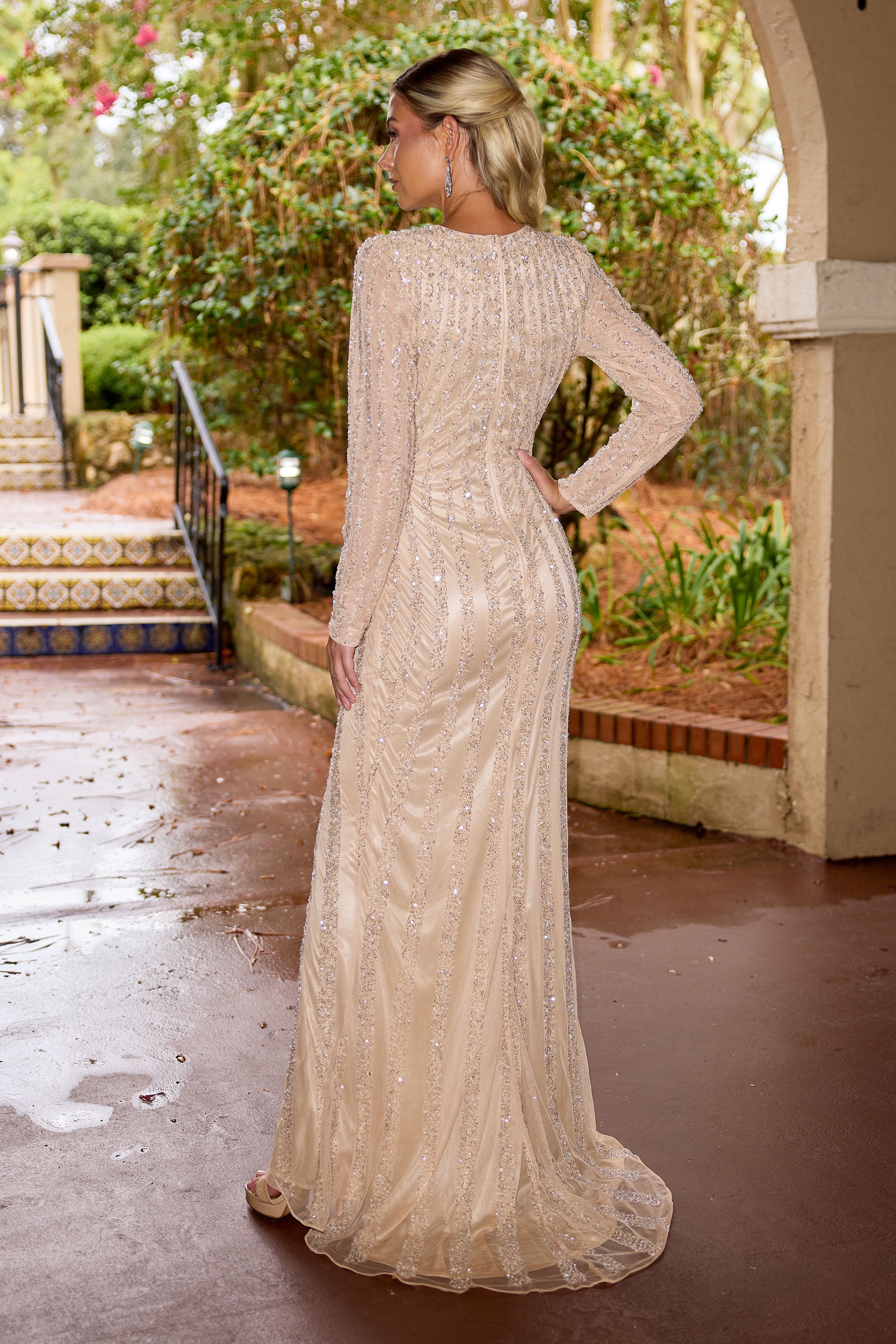 Primavera Couture -12209 Plunging deep V neckline gown with sequins and beaded work.